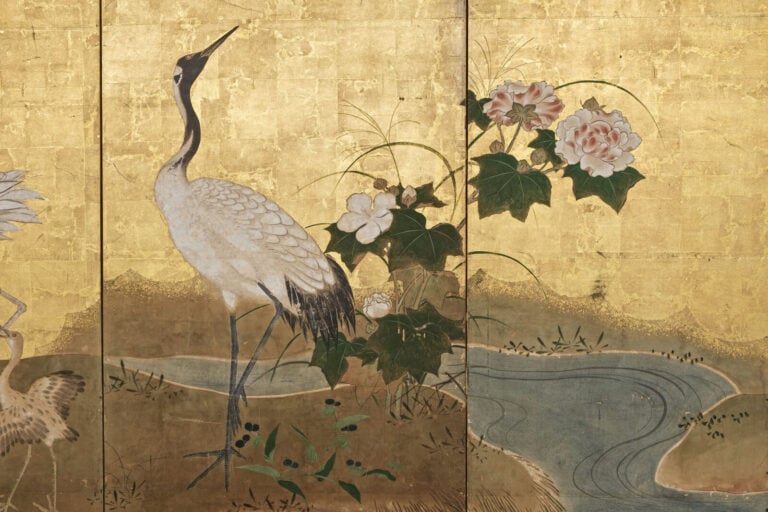 JAPON - XVIIème siècle - Grand paravent à six panneaux à décor, sur fond de feu…