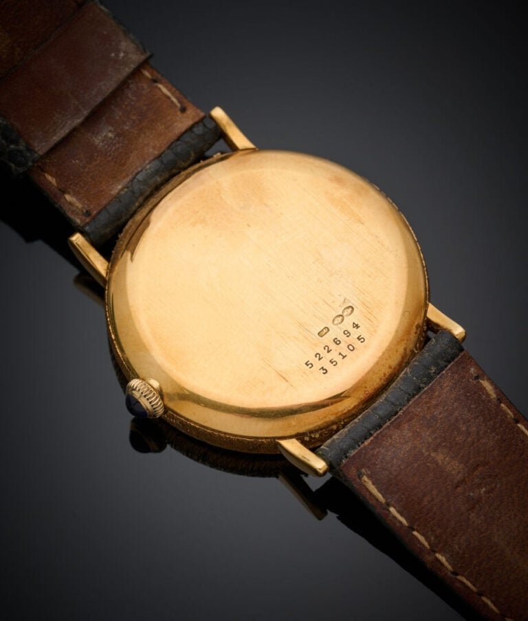 BAUME & MERCIER - BRACELET MONTRE ronde, modèle "Baumatic" en or jaune (750‰).…