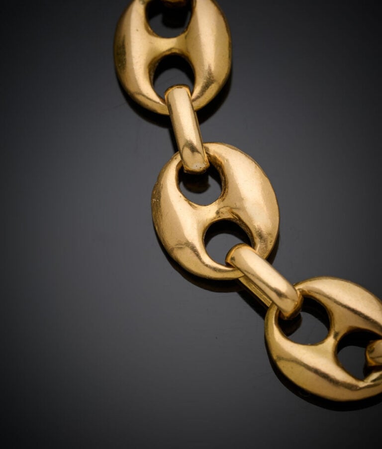 BRACELET en or jaune (750‰) à maille "grains de café". - Chaînette de sécurité.…