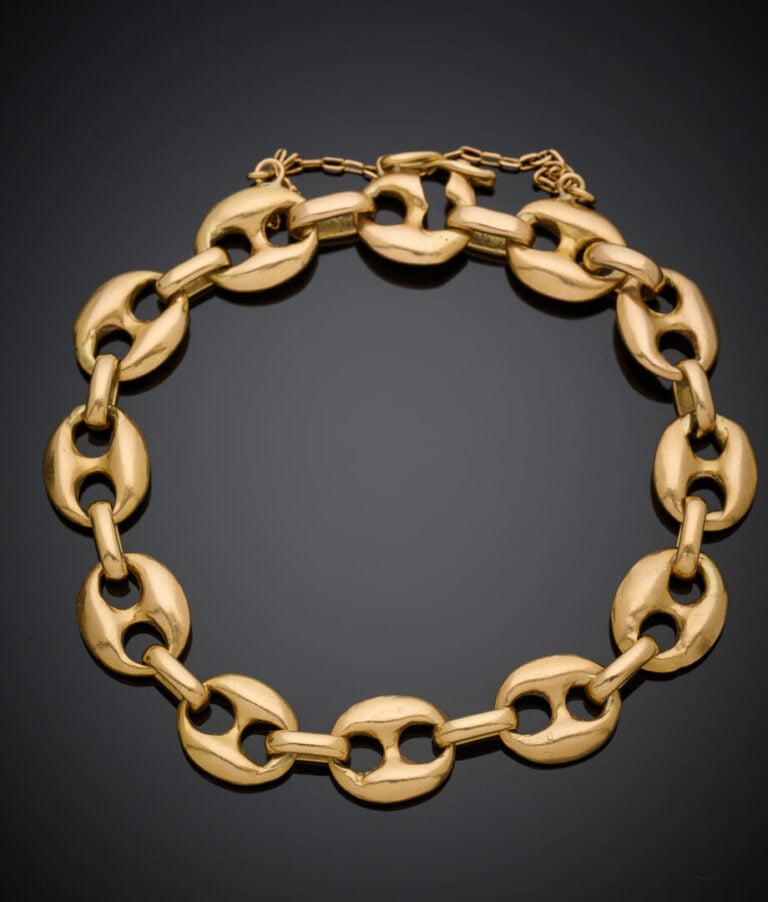 BRACELET en or jaune (750‰) à maille "grains de café". - Chaînette de sécurité.…
