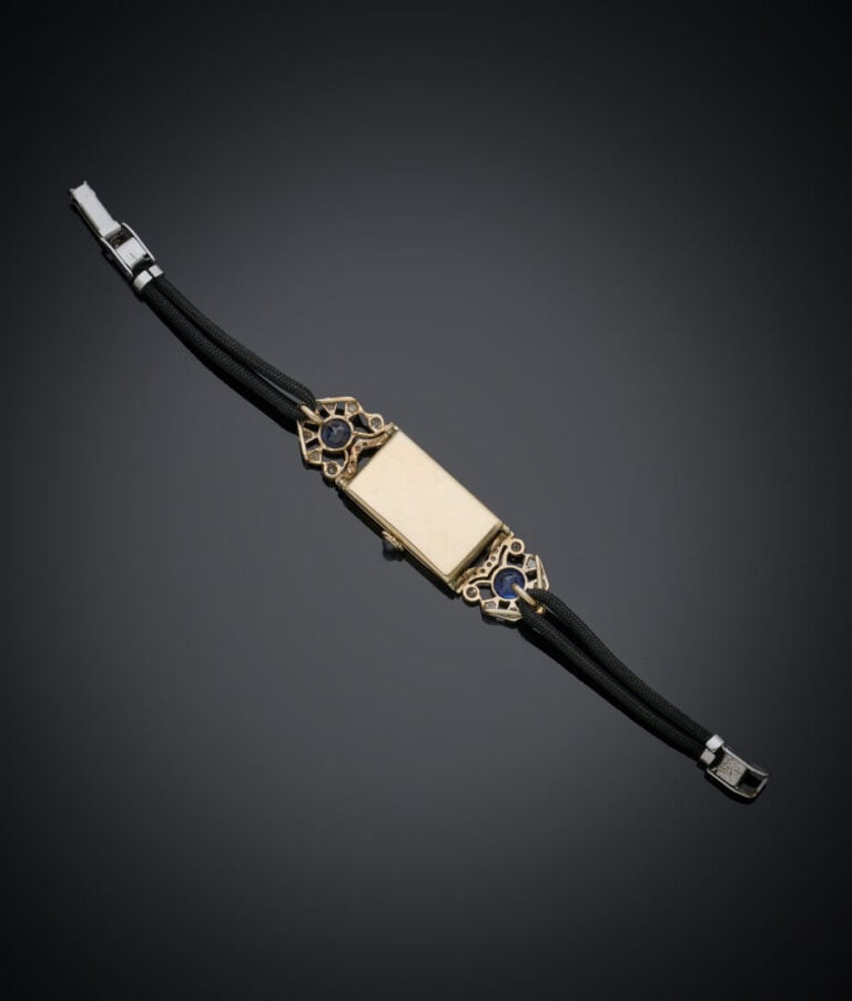 BRACELET MONTRE de dame rectangulaire en platine (min. 800‰) et or (750‰). Atta…