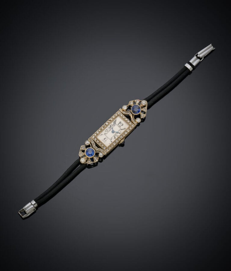 BRACELET MONTRE de dame rectangulaire en platine (min. 800‰) et or (750‰). Atta…
