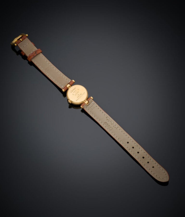 CARTIER - BRACELET MONTRE ronde de dame "Vendôme Mini" en or jaune (750‰). Cadr…