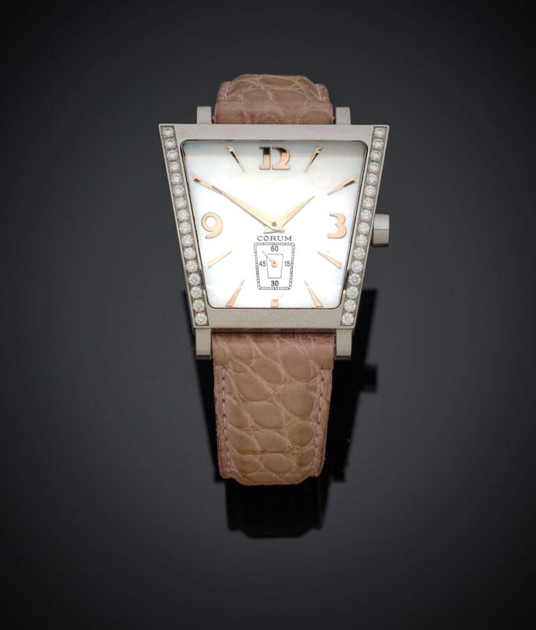 CORUM - BRACELET MONTRE « Trapèze » en acier. Lunette partiellement sertie d'al…