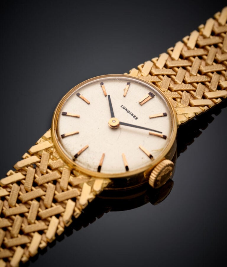 LONGINES - BRACELET MONTRE de dame ronde en or rose et jaune (750‰). Cadran crè…