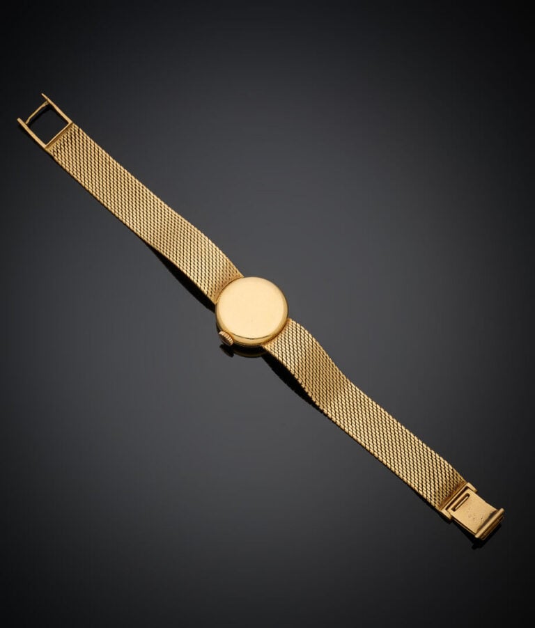 MOVADO - BRACELET MONTRE ronde de dame en or jaune (750‰). Cadran doré (usures)…