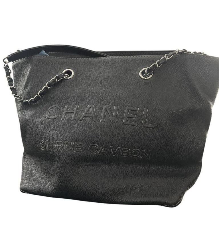 Sac cabas en cuir grainé noir, double anse en métal argenté entrelacé de cuir à…