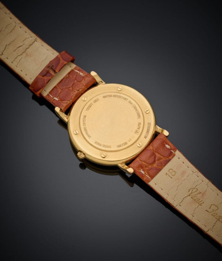TISSOT - BRACELET MONTRE d'homme ronde en or jaune (750‰). Cadran émail blanc,…